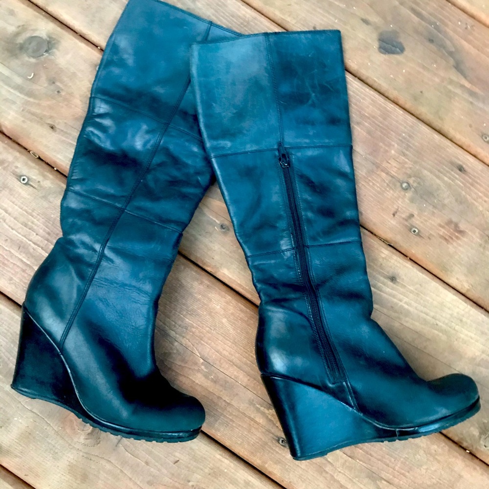 Tall wedge leather boots